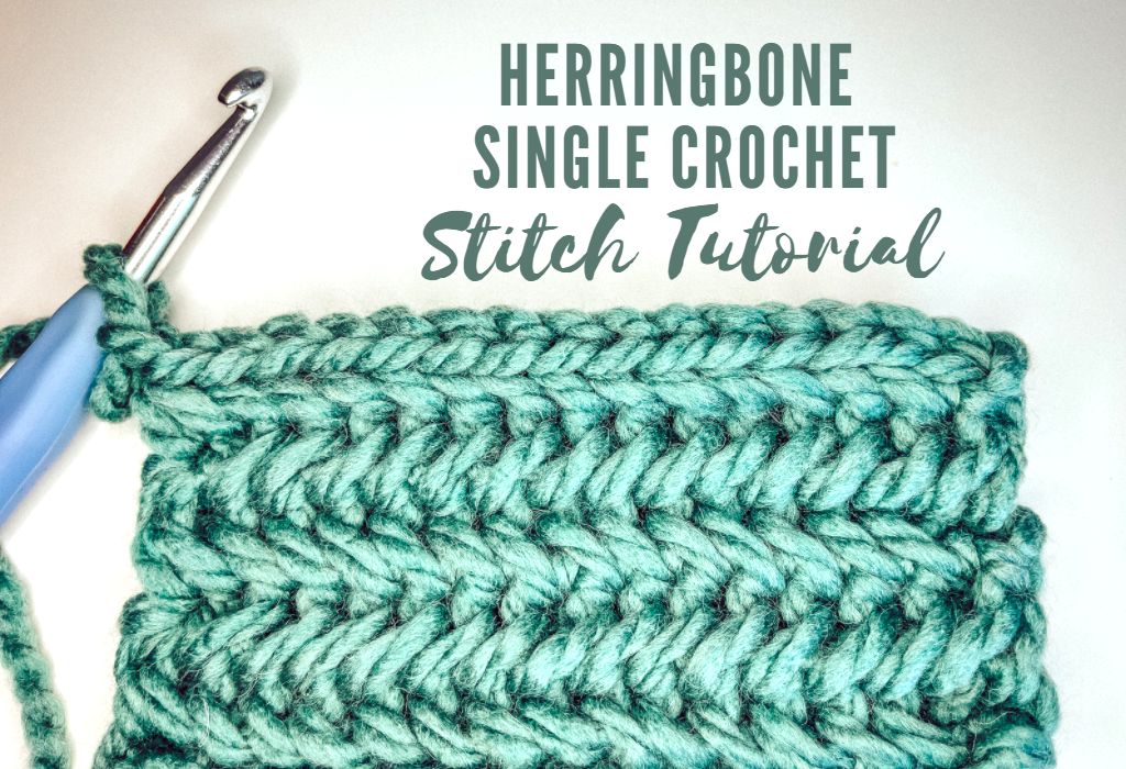 The image shows a modern crochet stitch swatch in green yarn of the Herringbone Single Crochet stitch. A crochet hook is also shown. The swatch and hook are on a white background. Dark green text at the top reads "Herringbone Single Crochet Stitch Tutorial"