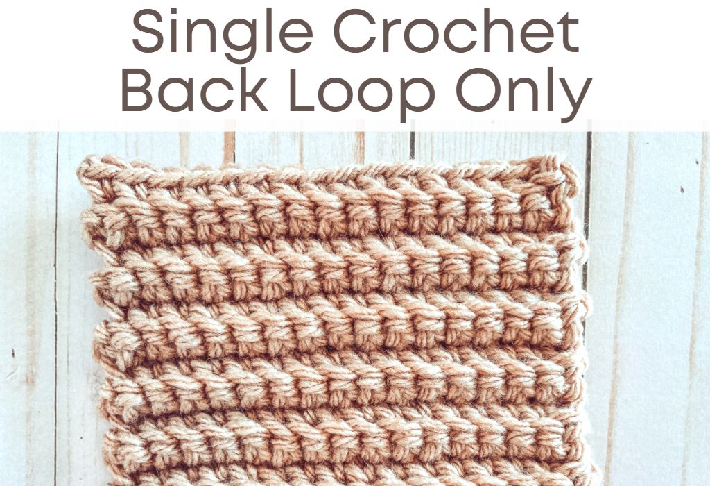 A crochet swatch of the single crochet stitch in beige yarn is on a wood background. Text at the top says "Single Crochet Back Loop Only"