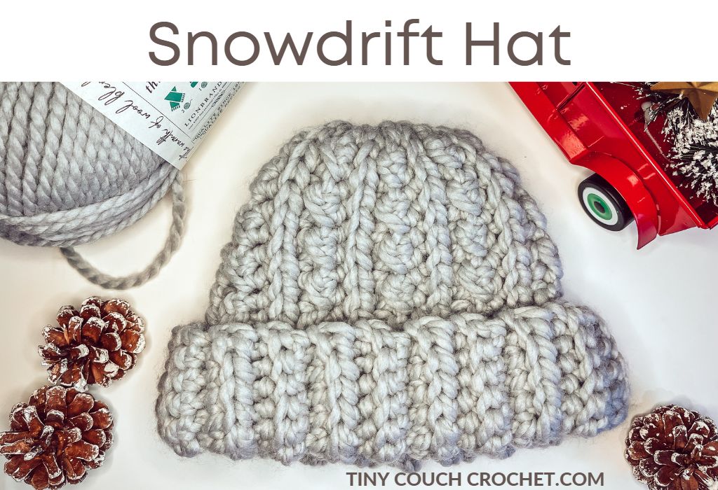 A photo of a chunky crochet beanie with the text "snowdrift hat"