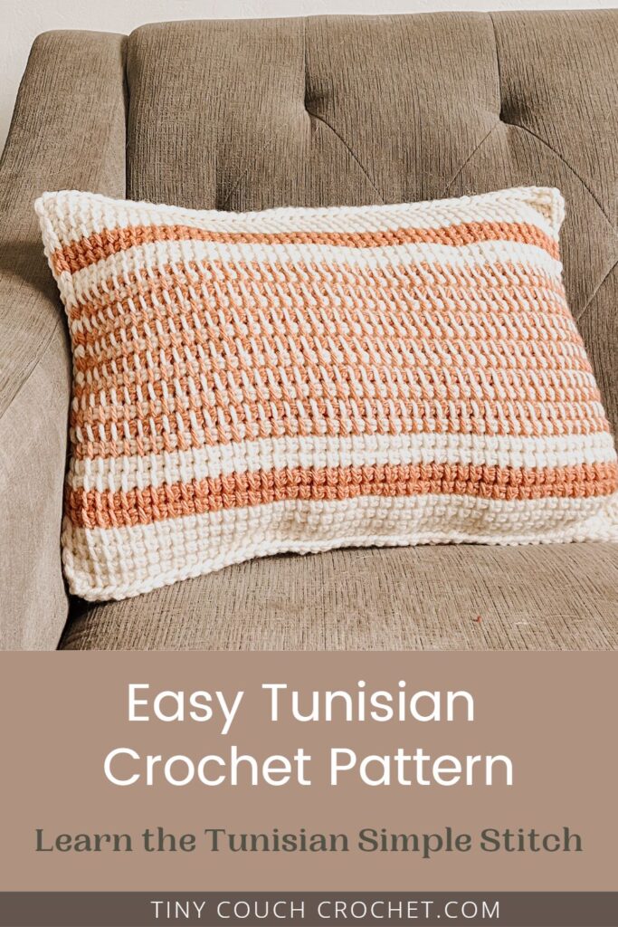 A pink and white striped Tunisian Crochet pillow on a gray couch with text that reads: easy tunisian crochet pattern, learn the tunisian simple stitch, tinycouchcrochet.com